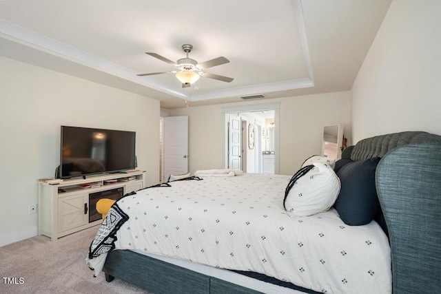 220 Green Haven Blvd, Youngsville, NC 27596 - bedroom featuring ornamental molding, visible vents, light carpet, and a raised ceiling
