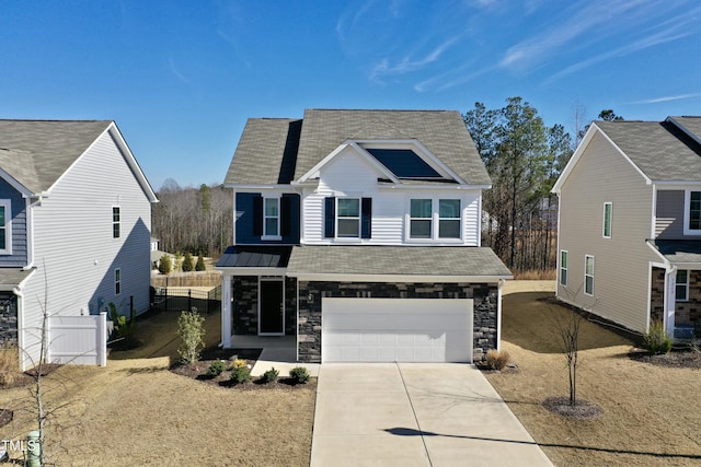 view of front of property with a garage and a front yard