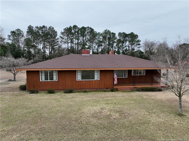 single story home featuring a front lawn