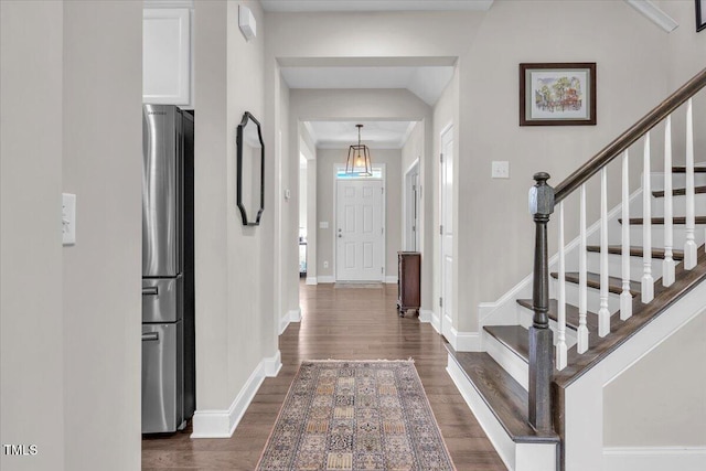 208 Cecelia Ct, Cary, NC 27519 - foyer entrance with dark wood-type flooring, baseboards, and stairway