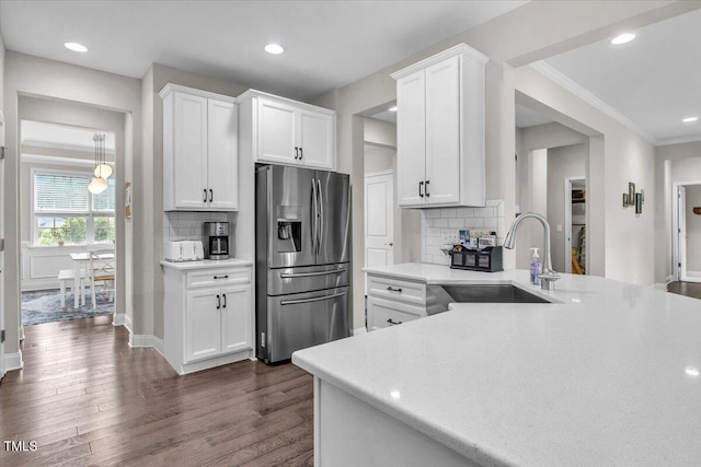 208 Cecelia Ct, Cary, NC 27519 - kitchen with stainless steel refrigerator with ice dispenser, a sink, dark wood-style floors, light countertops, and recessed lighting