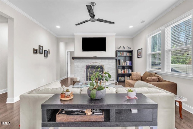 208 Cecelia Ct, Cary, NC 27519 - living room featuring baseboards, wood finished floors, recessed lighting, ceiling fan, and a glass covered fireplace