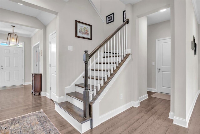 208 Cecelia Ct, Cary, NC 27519 - entrance foyer featuring wood finished floors, baseboards, and stairs