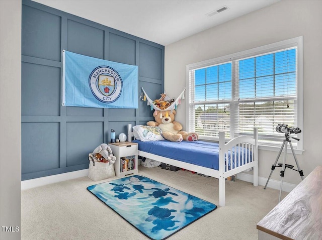 208 Cecelia Ct, Cary, NC 27519 - bedroom with carpet, a decorative wall, and baseboards