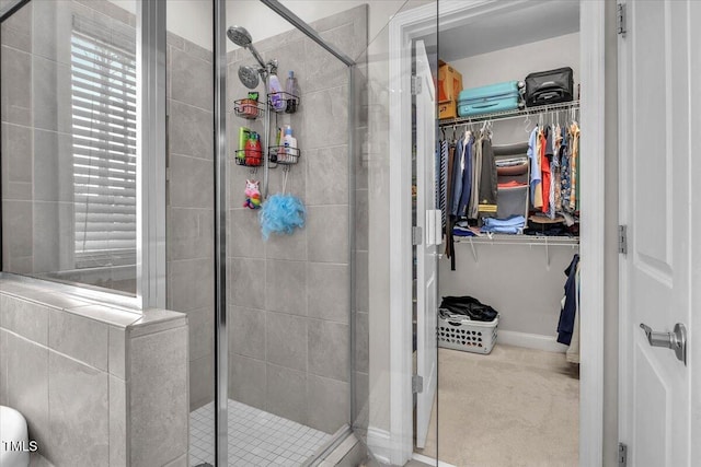 208 Cecelia Ct, Cary, NC 27519 - full bathroom with a shower stall, a walk in closet, and baseboards