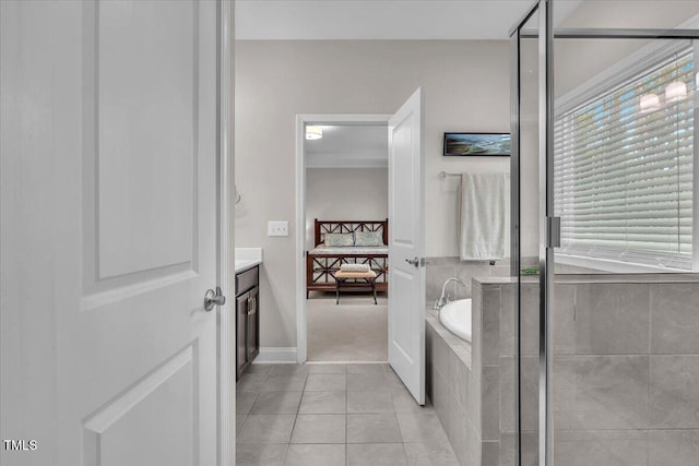 208 Cecelia Ct, Cary, NC 27519 - bathroom featuring ensuite bathroom, a garden tub, vanity, tile patterned floors, and a shower with shower door