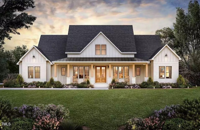 modern farmhouse style home with a lawn and a porch