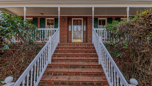 entrance to property with a porch