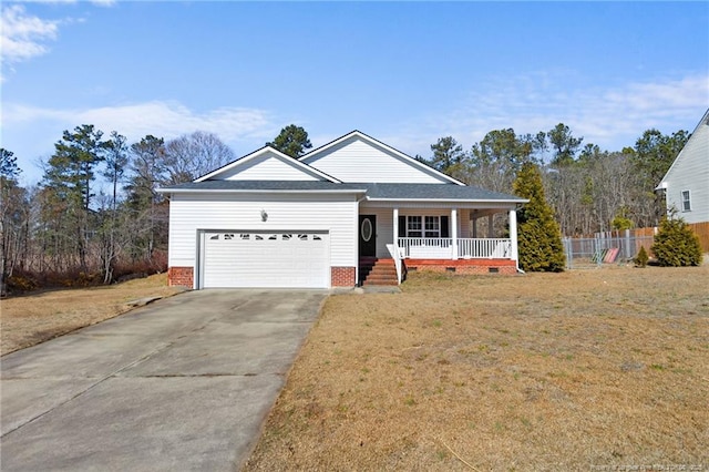 view of front facade featuring a garage, a porch, and a front yard