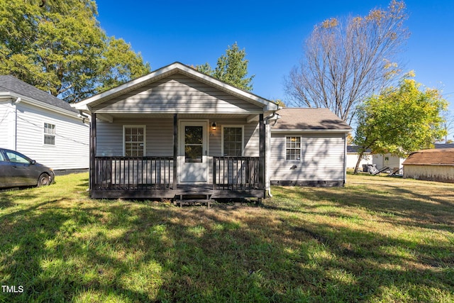 bungalow-style home with a front lawn and a porch