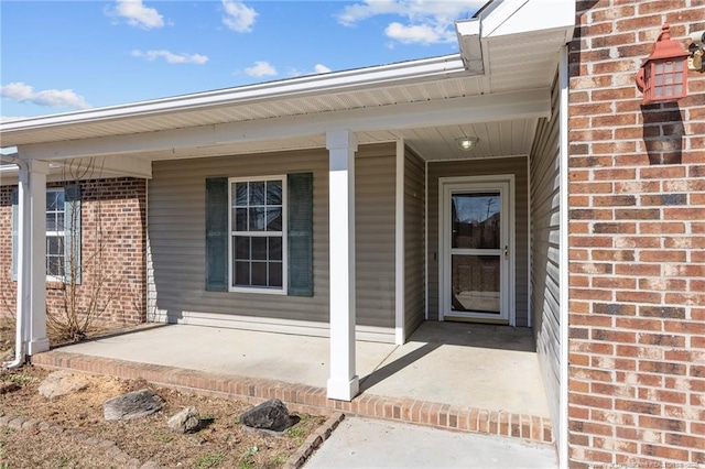 entrance to property featuring a porch