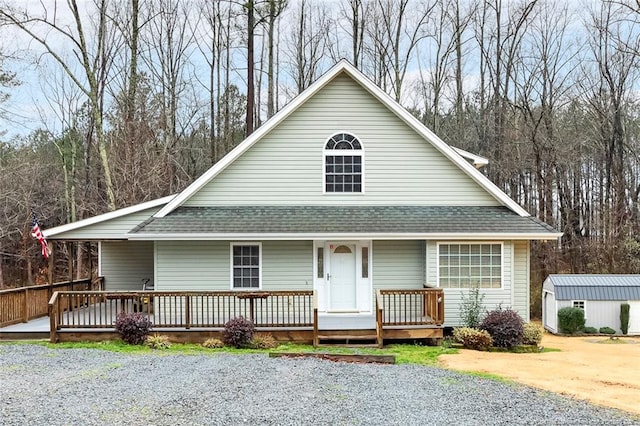 view of front of house featuring a storage unit