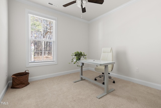 office featuring a ceiling fan, baseboards, visible vents, carpet, and crown molding