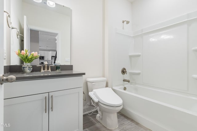 full bathroom with vanity, toilet, and shower / bathtub combination