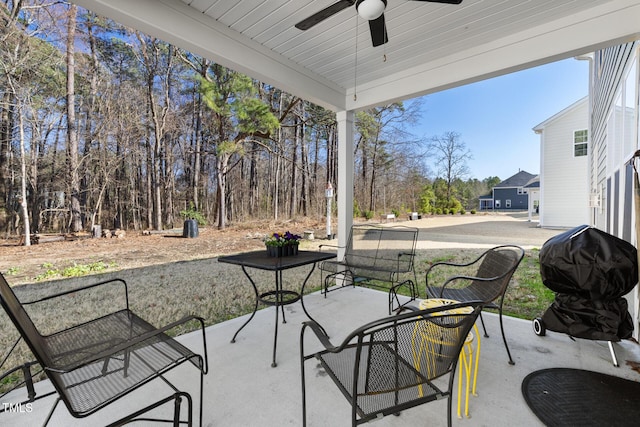 view of patio / terrace featuring area for grilling and a ceiling fan