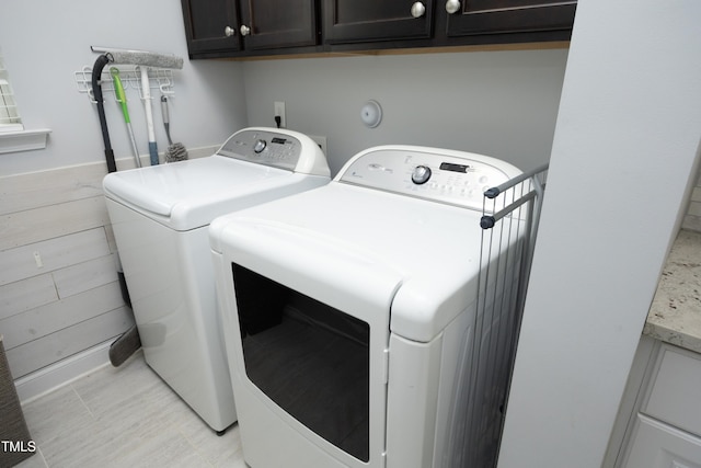 laundry area featuring cabinet space and washer and clothes dryer