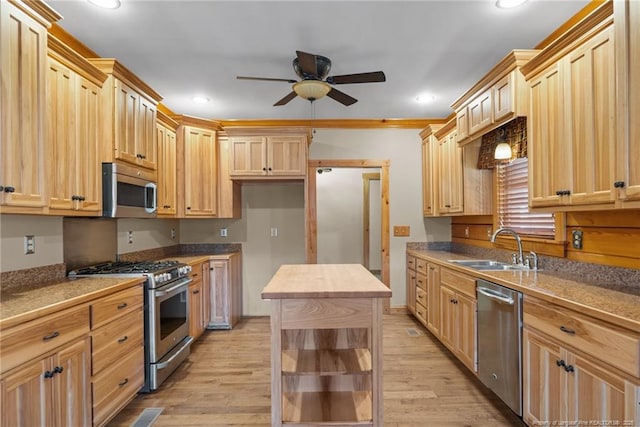 526 Grimble Dr, Linden, NC 28356 - kitchen featuring stainless steel appliances, sink, light brown cabinets, and light hardwood / wood-style flooring