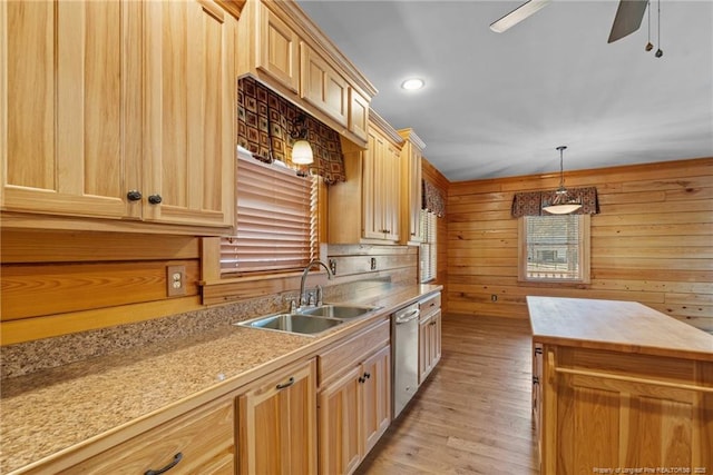 526 Grimble Dr, Linden, NC 28356 - kitchen with wooden walls, dishwasher, sink, light brown cabinets, and light hardwood / wood-style flooring