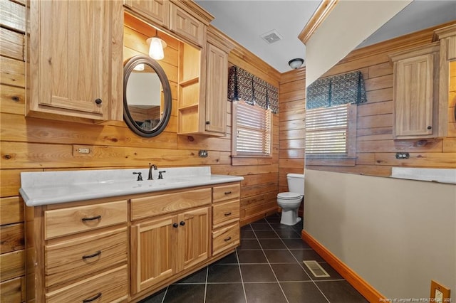 526 Grimble Dr, Linden, NC 28356 - bathroom with wooden walls, vanity, ornamental molding, tile patterned floors, and toilet