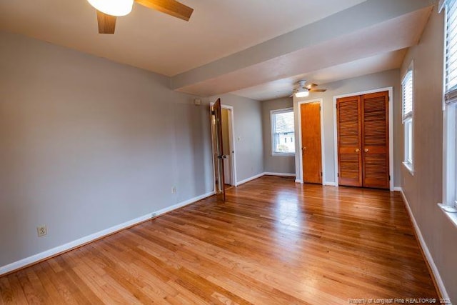 unfurnished bedroom featuring ceiling fan and light hardwood / wood-style flooring