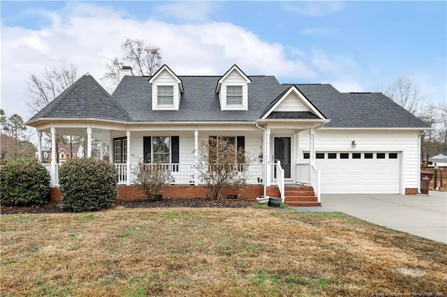 view of front of house featuring a garage, a porch, and a front yard