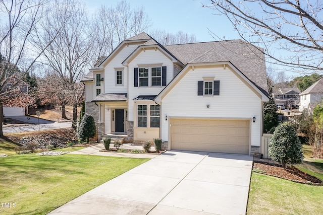 view of front of house featuring a garage and a front lawn