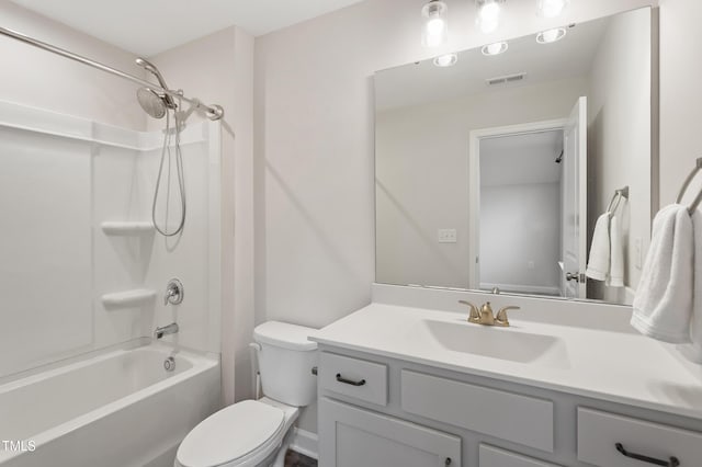 bathroom featuring washtub / shower combination, visible vents, vanity, and toilet