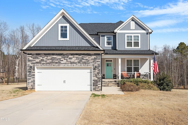 craftsman house featuring a porch, a garage, a shingled roof, concrete driveway, and board and batten siding