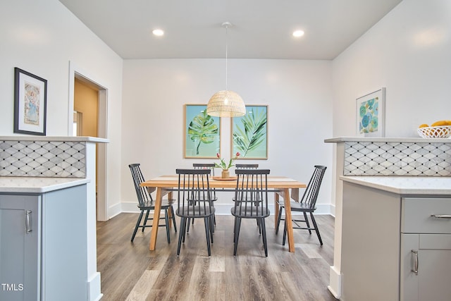 dining area featuring wood-type flooring