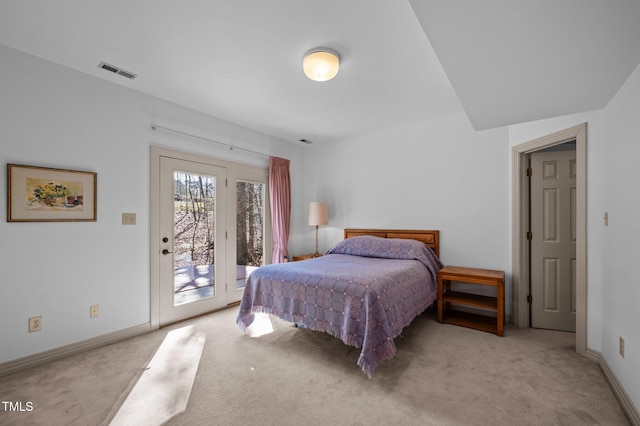 bedroom featuring access to exterior, light colored carpet, visible vents, and baseboards