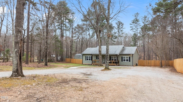 view of front of house featuring fence and driveway