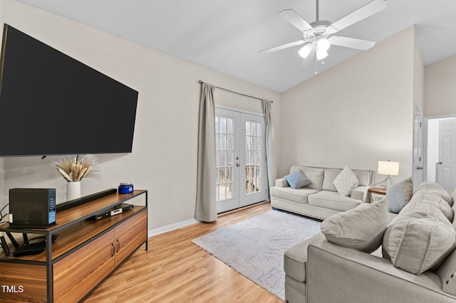 living room with ceiling fan, lofted ceiling, baseboards, french doors, and light wood finished floors