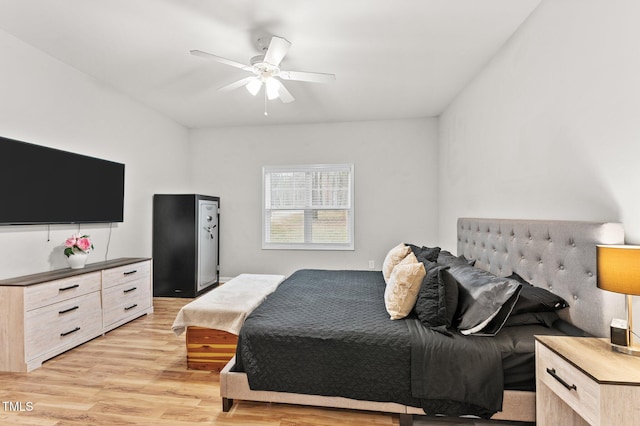 bedroom with light wood-type flooring and a ceiling fan