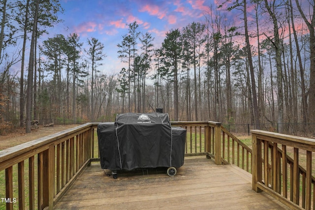 wooden terrace featuring area for grilling