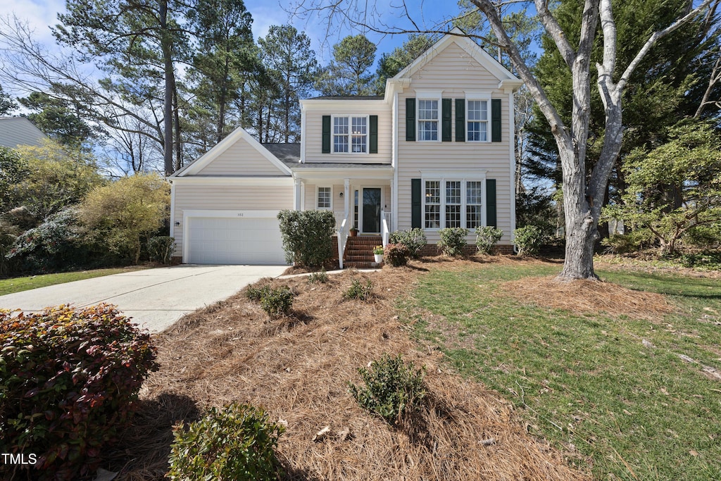 102 Ashley Brook Ct, Cary, NC 27513 - view of front facade with a front lawn, driveway, and an attached garage