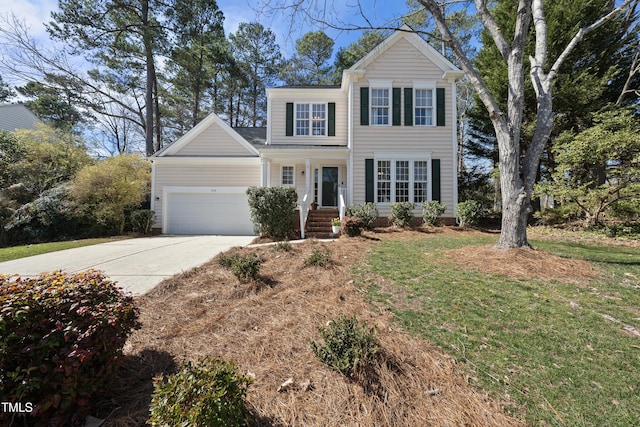 view of front facade with a front lawn, driveway, and an attached garage