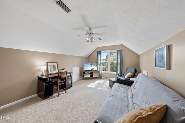 interior space with light carpet, baseboards, visible vents, a ceiling fan, and lofted ceiling