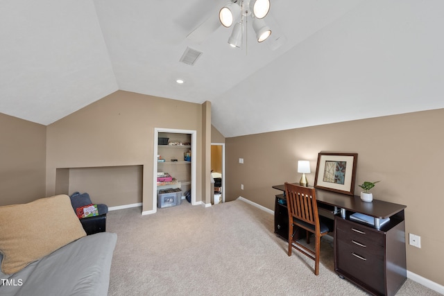 office with light carpet, baseboards, visible vents, and vaulted ceiling