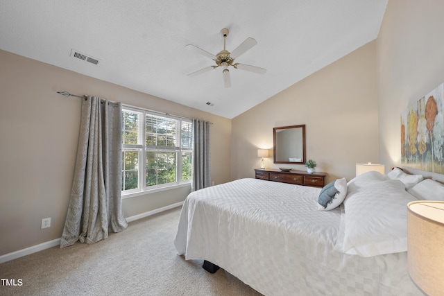 bedroom with lofted ceiling, ceiling fan, carpet floors, visible vents, and baseboards