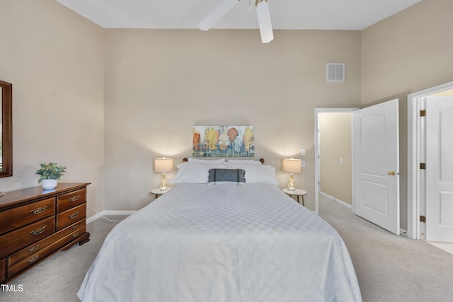 carpeted bedroom featuring visible vents and baseboards