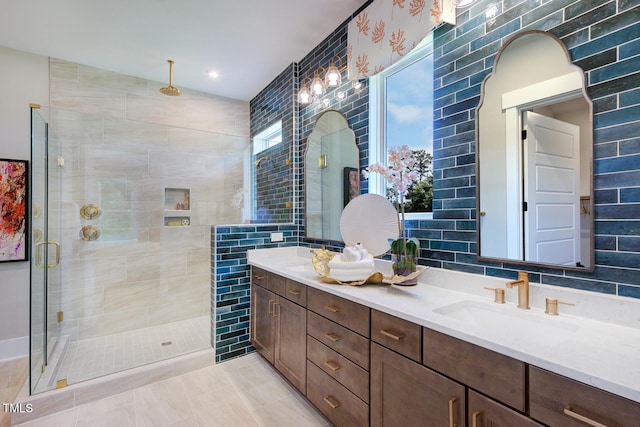 bathroom featuring vanity, tile walls, and a shower with shower door