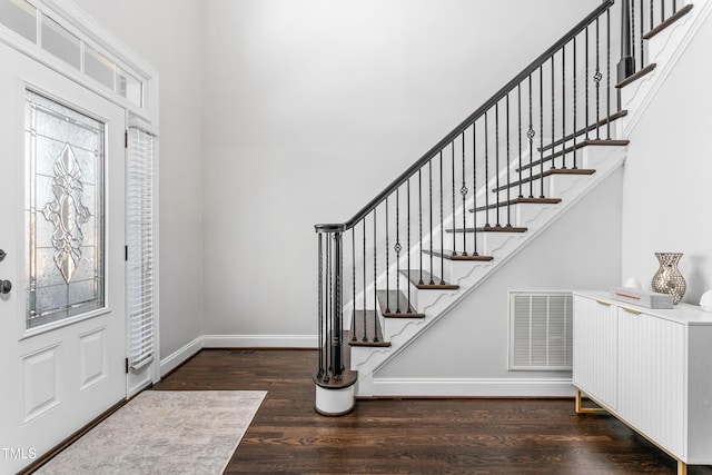 foyer with dark wood-type flooring