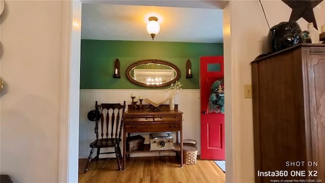 corridor with hardwood / wood-style flooring