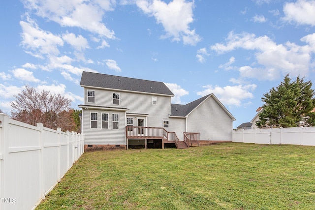 back of property with crawl space, a fenced backyard, a yard, and a deck