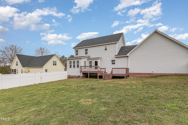 rear view of property with a yard, crawl space, fence, and a wooden deck