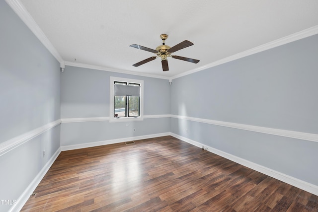 empty room with crown molding, dark wood-type flooring, and ceiling fan