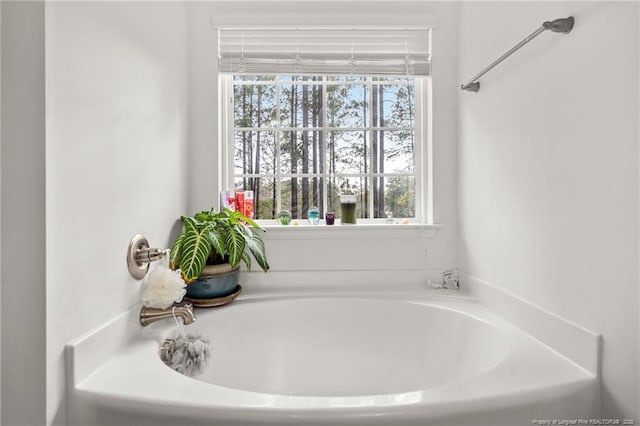 bathroom featuring a tub