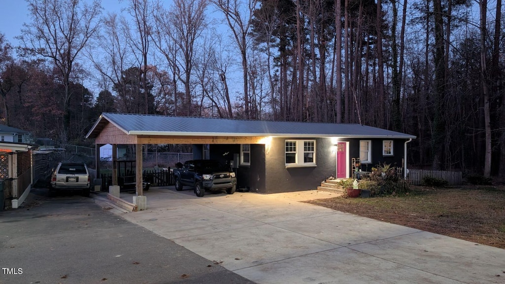 exterior space with a carport