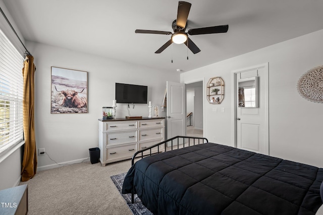 bedroom with light colored carpet and ceiling fan