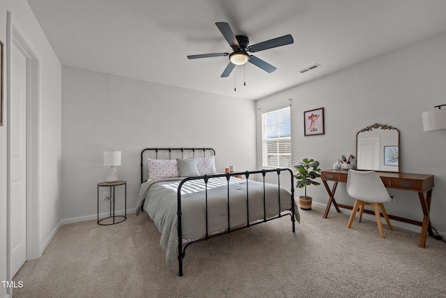 bedroom featuring light carpet and ceiling fan